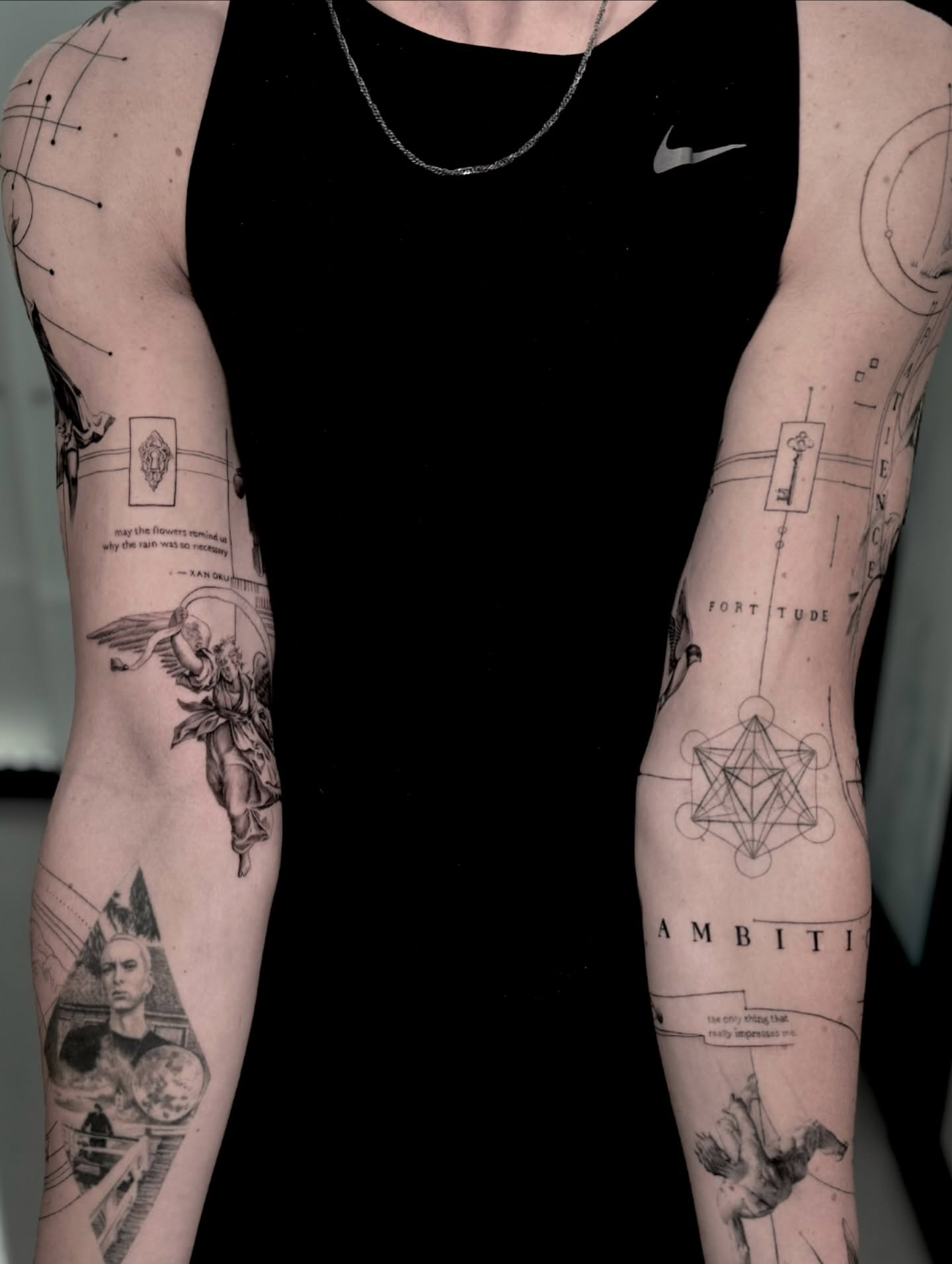 Side angle where geometric lines and figurative elements follow the length of the arm